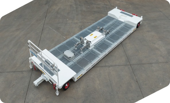 Carro blanco para el traslado de componentes aeronáuticos visto desde arriba